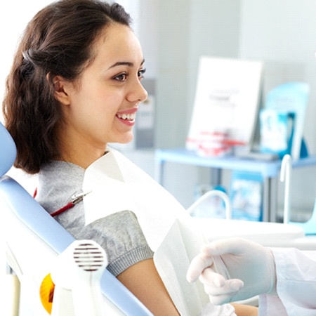 Periodontist explaining how gum grafting treatment works