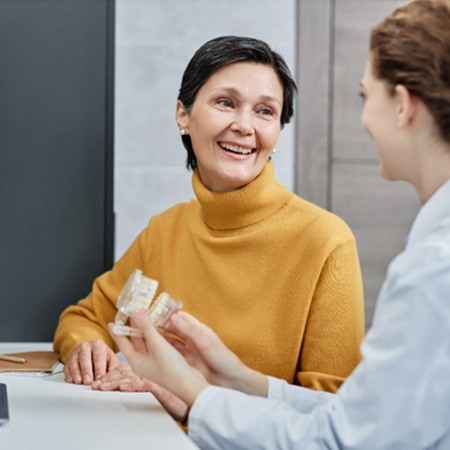 Woman speaking with dentist