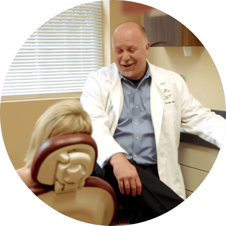 Friendly Louisville periodontist talking to a patient
