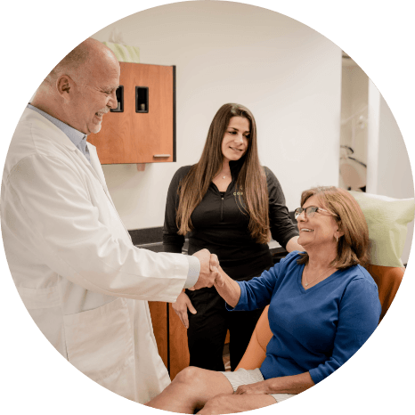 Friendly Louisville periodontist talking to a patient