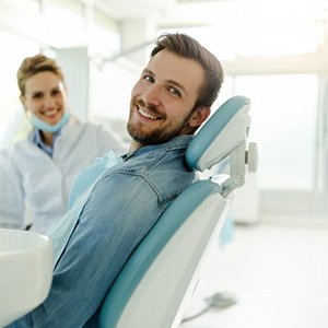 a dental assistant prepping a patient for I V sedation