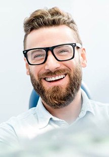 man smiling while visiting periodontist near Springhurst