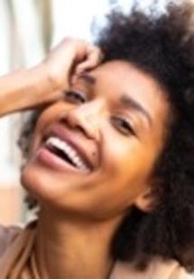 woman smiling while visiting periodontist near Springhurst