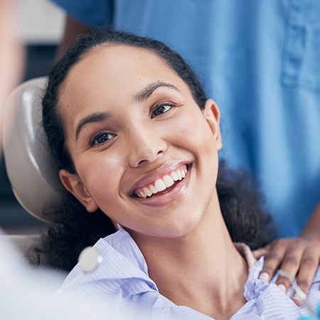 a dental patient smiling during an oral cancer screening