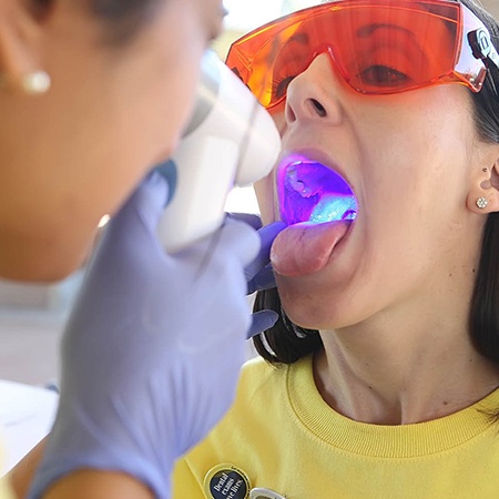 Patient receiving oral cancer screening