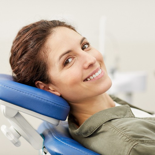 Woman smiling after full mouth reconstruction in Louisville