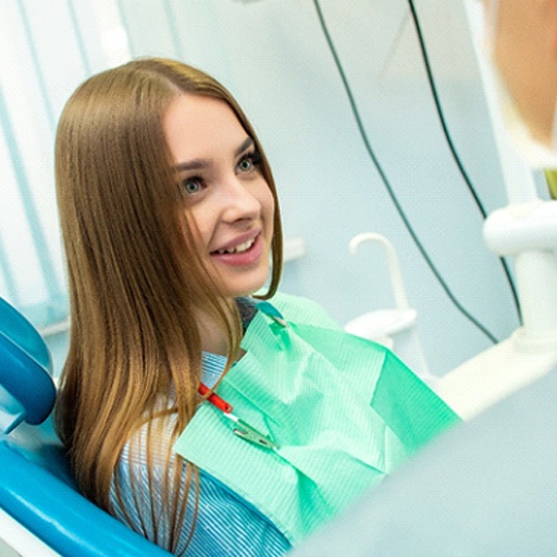 Woman speaking with a sedation dentist in Louisville