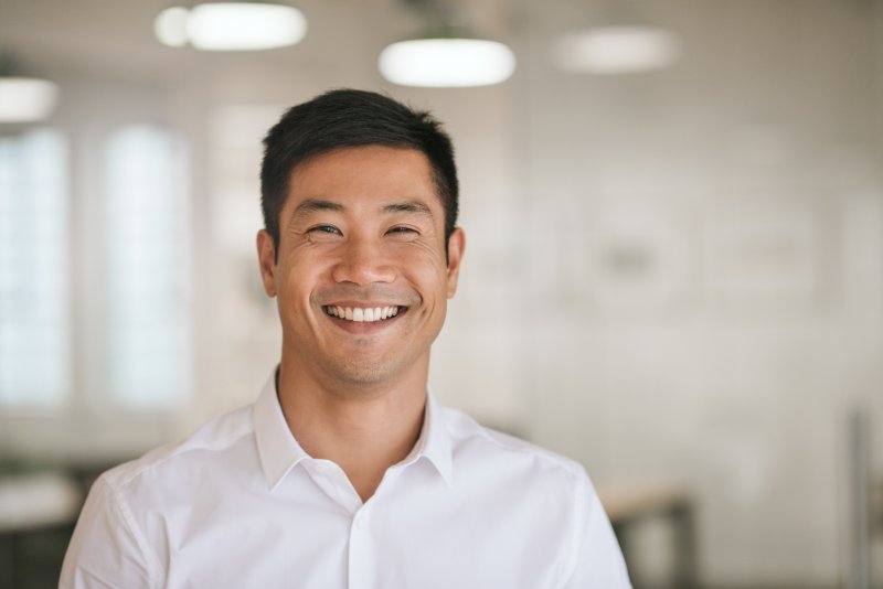 person smiling after full mouth reconstruction