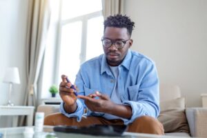 Man checking his blood glucose