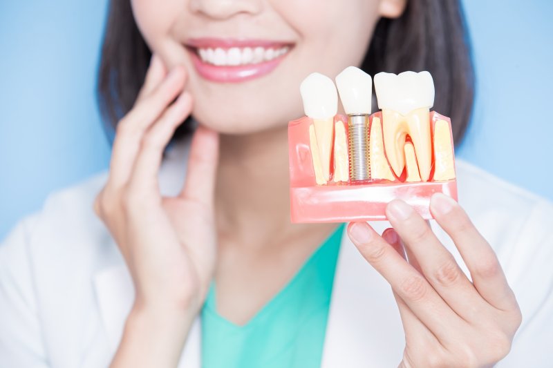 A closeup of an enlarged dental implant model