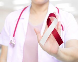 Dentist showing an oral cancer ribbon