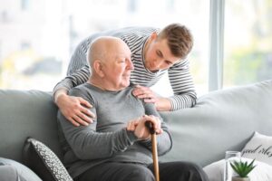 Family member checking on senior patient